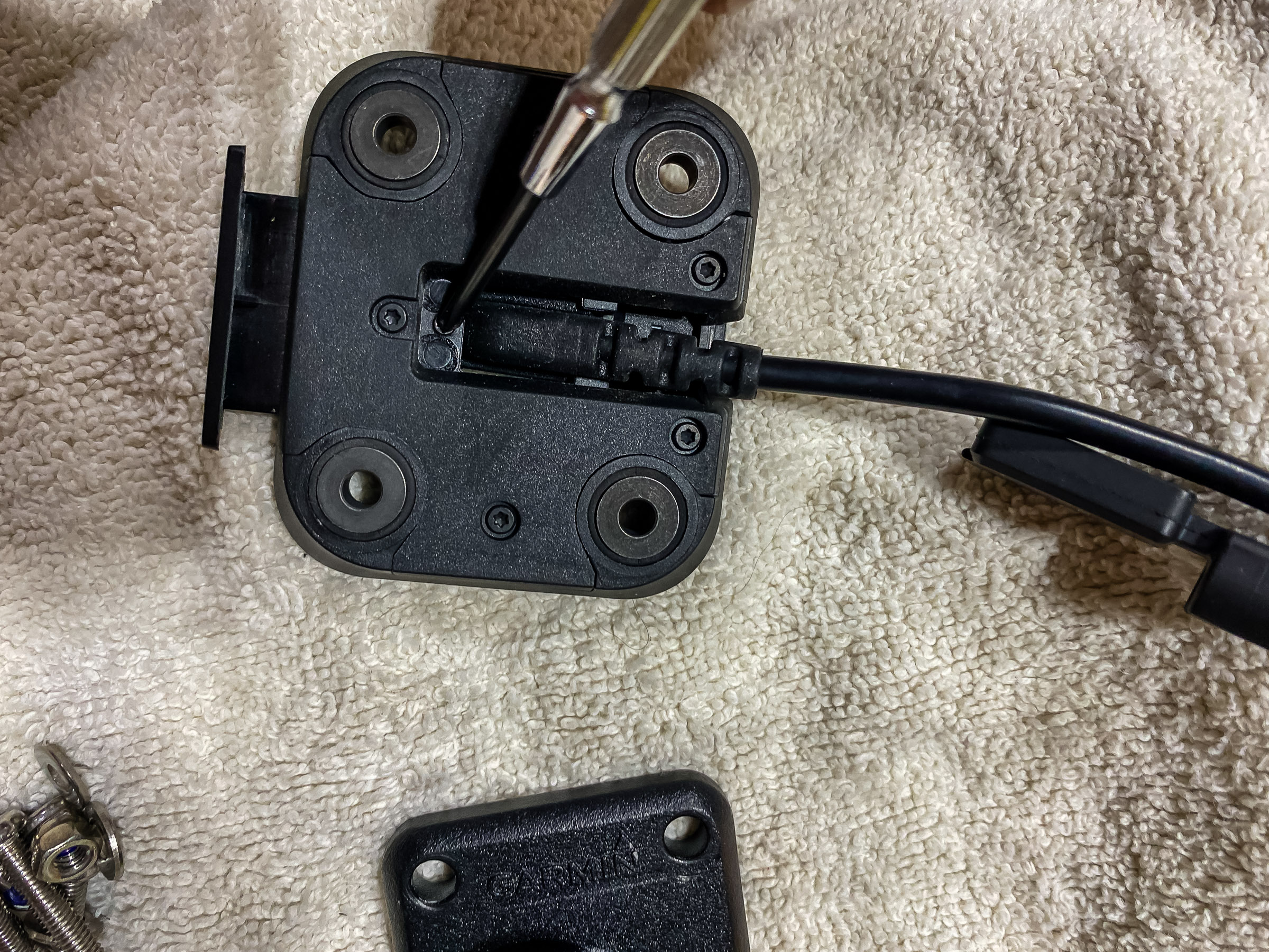 Screw the power cable connector to the motorcycle mount.