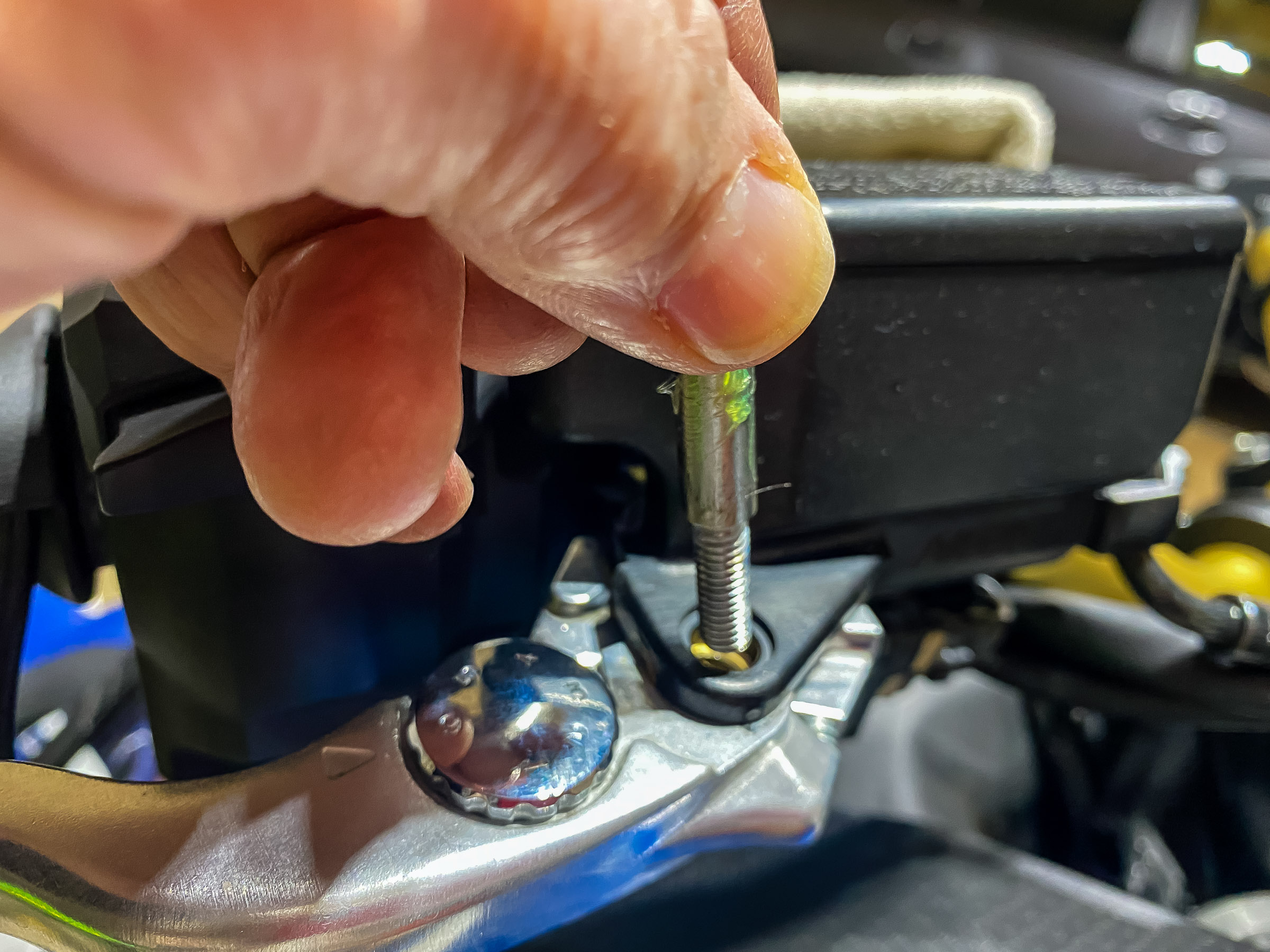 Grease the pin and push it down through the brake lever bushing.