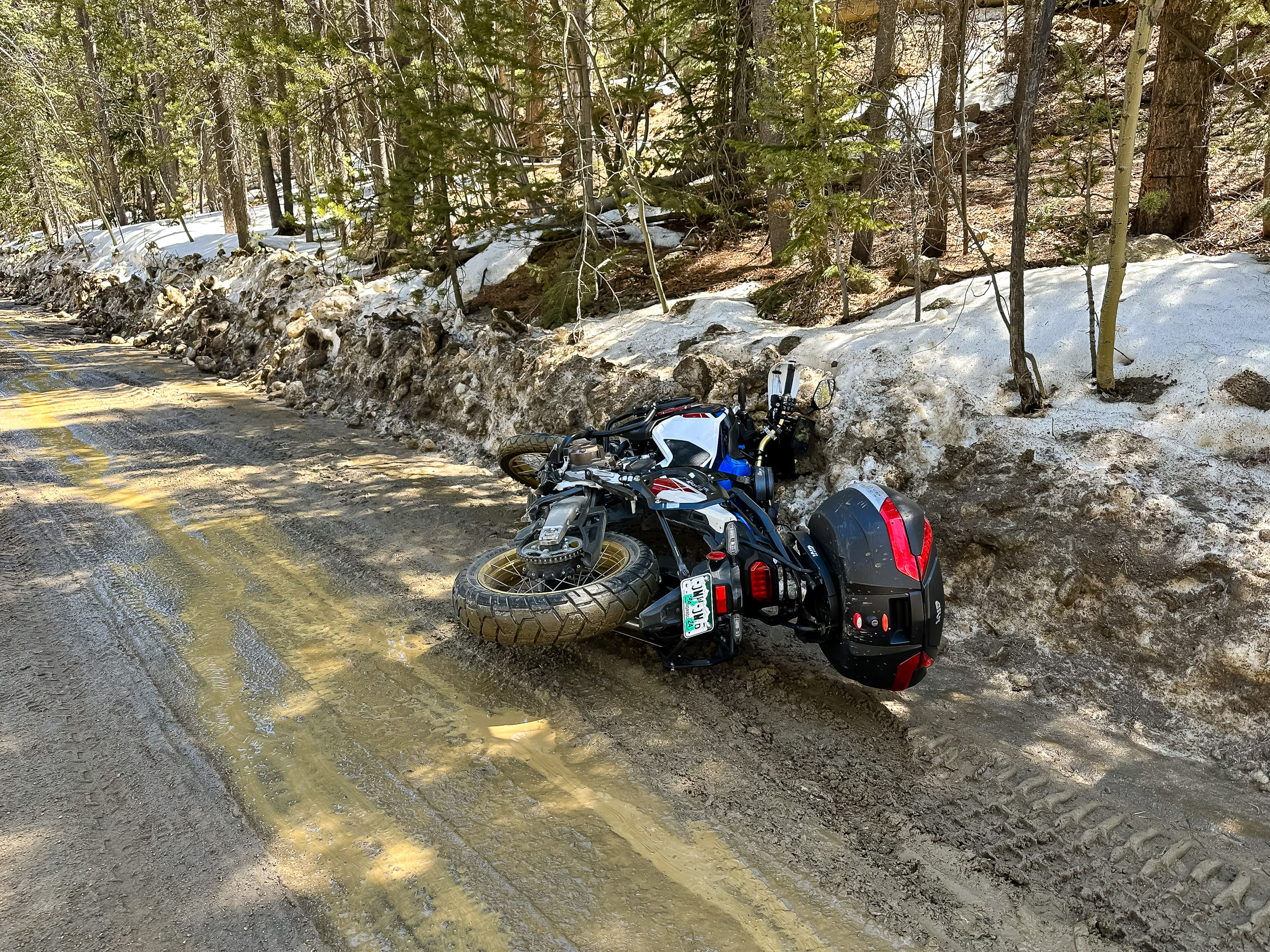 I dropped the bike on its right side. The  adjustable windscreen got pushed to the left popping the rail guides out of the track.