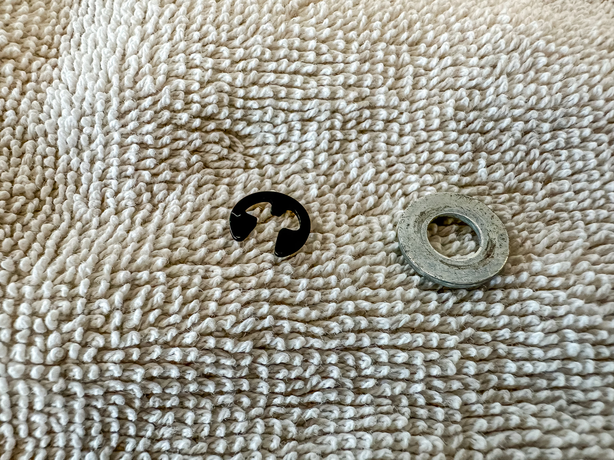 this is an E-ring retainer clip for 65 cents. I think it's a 3/16" clip.. I had a washer.