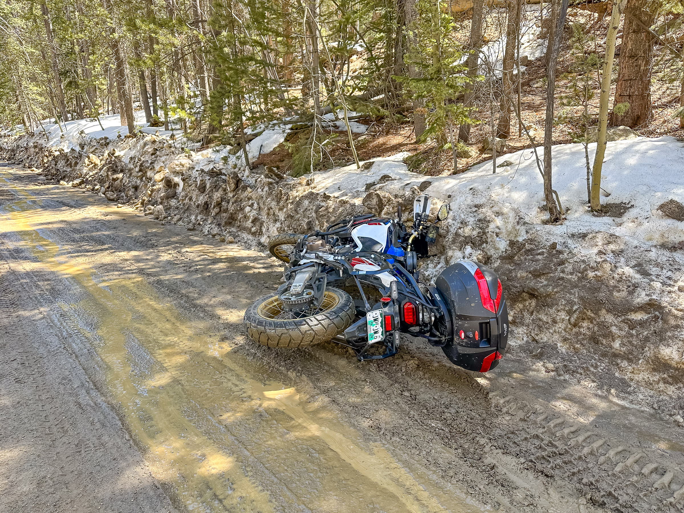 The bike slid into a left-over melting snow bank full of sand and rocks created earlier in the week by a snow plow. It scratched up the windscreen really bad.