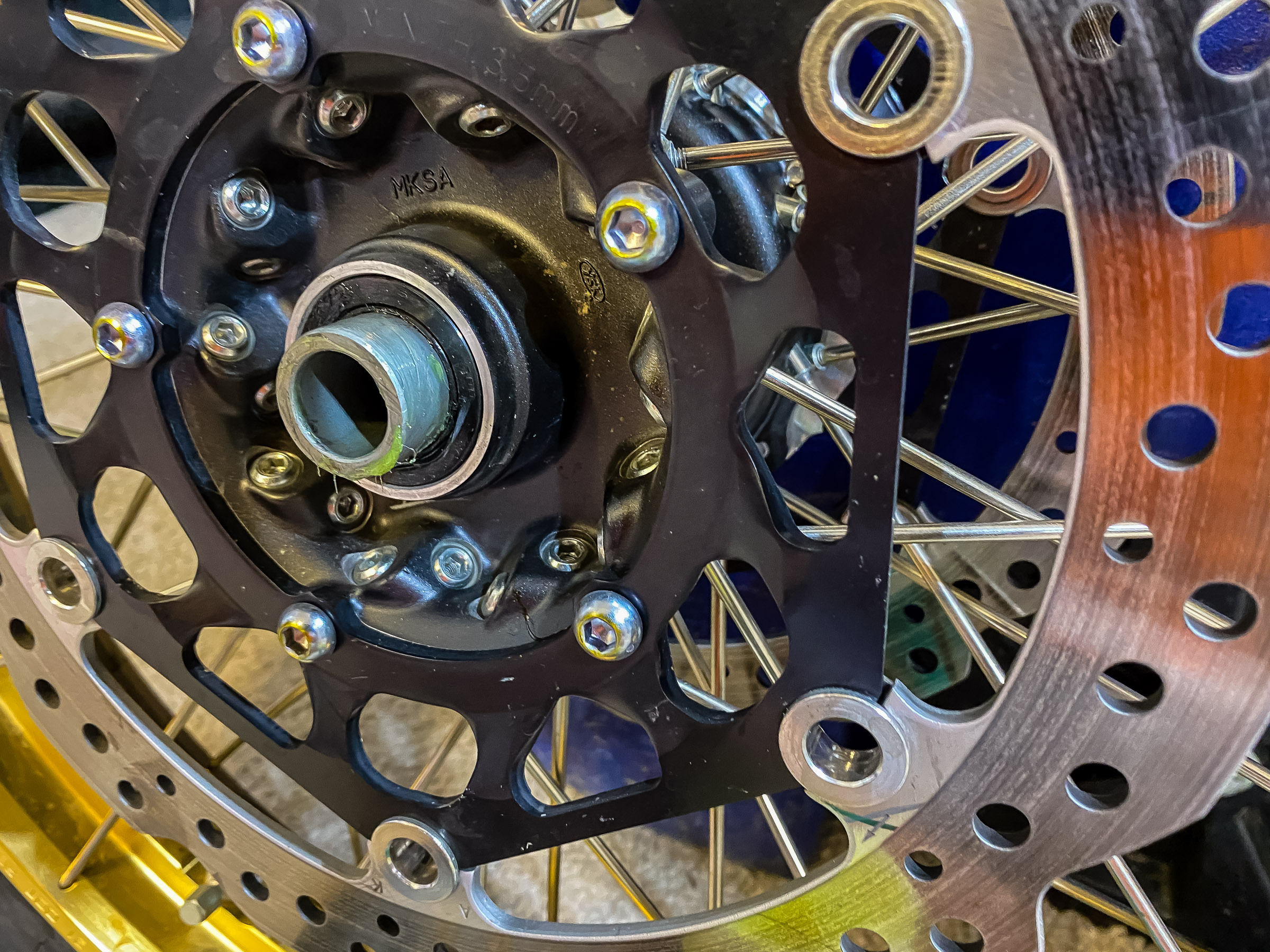 Clean off the side collars and grease. These are also called wheel spacers.