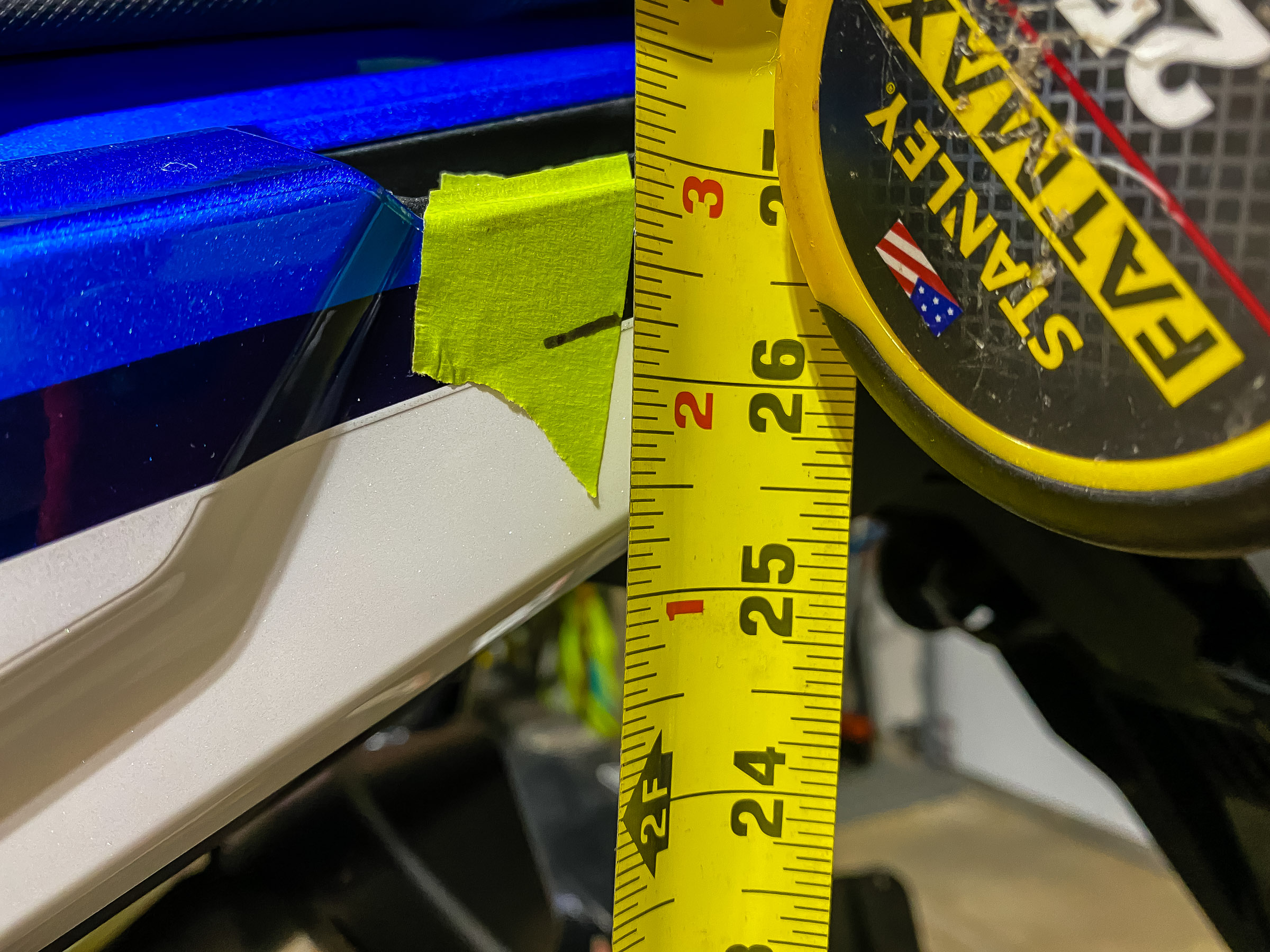 I  measured the distance with the dropped rear wheel which is 26-1/4. The difference between the 2 measurements is 1..625" or 1-5/8", which is the static sag.