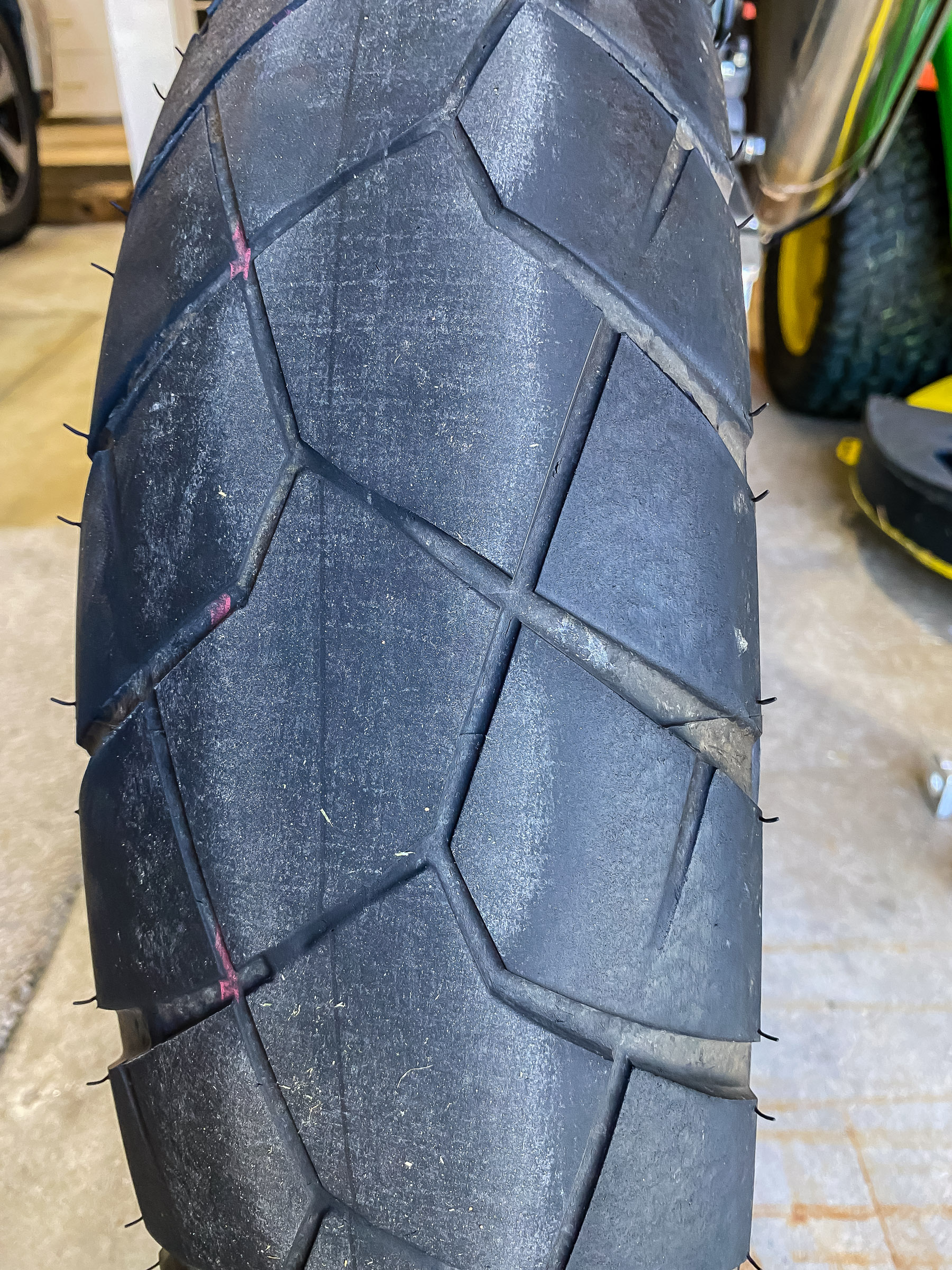 You're usually removing the rear wheel to replace the tire. There is no more tread in the center of this tire at 4771 miles.