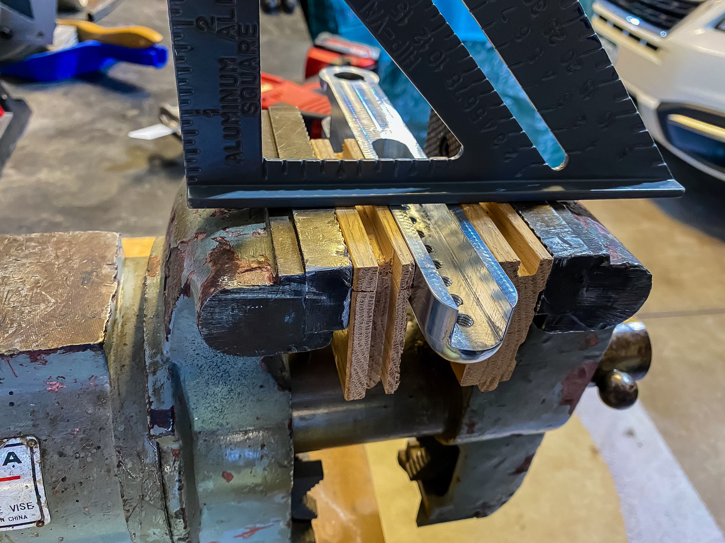 I'm going to shorten the stand by cutting 3/4" off the end of both pieces. I mounted the main stand in the vise so the front would be square.