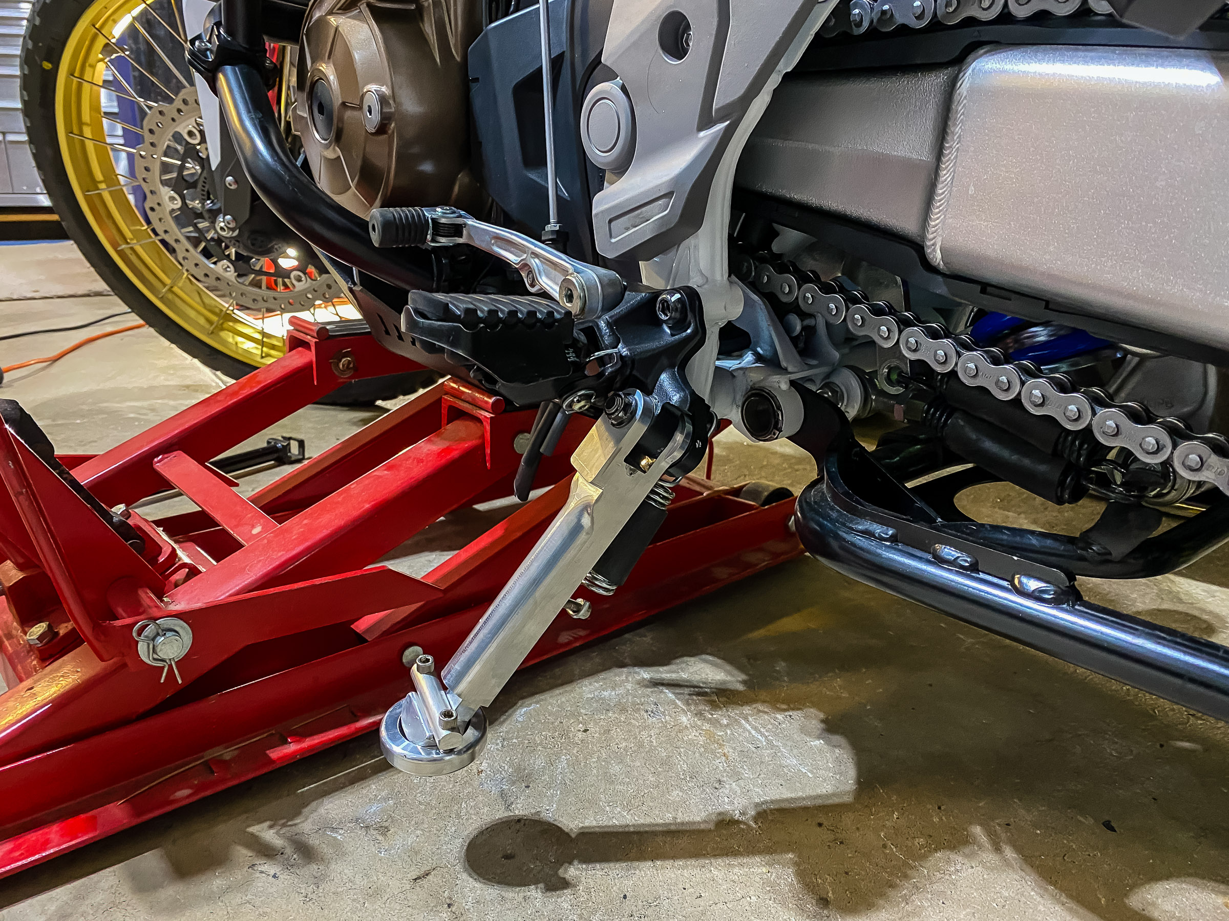 The stand went on easy as did the spring because it wasn't streatched as far. The new bike leaned over 28 degrees. With this latest change the bike leans over 32 degrees.