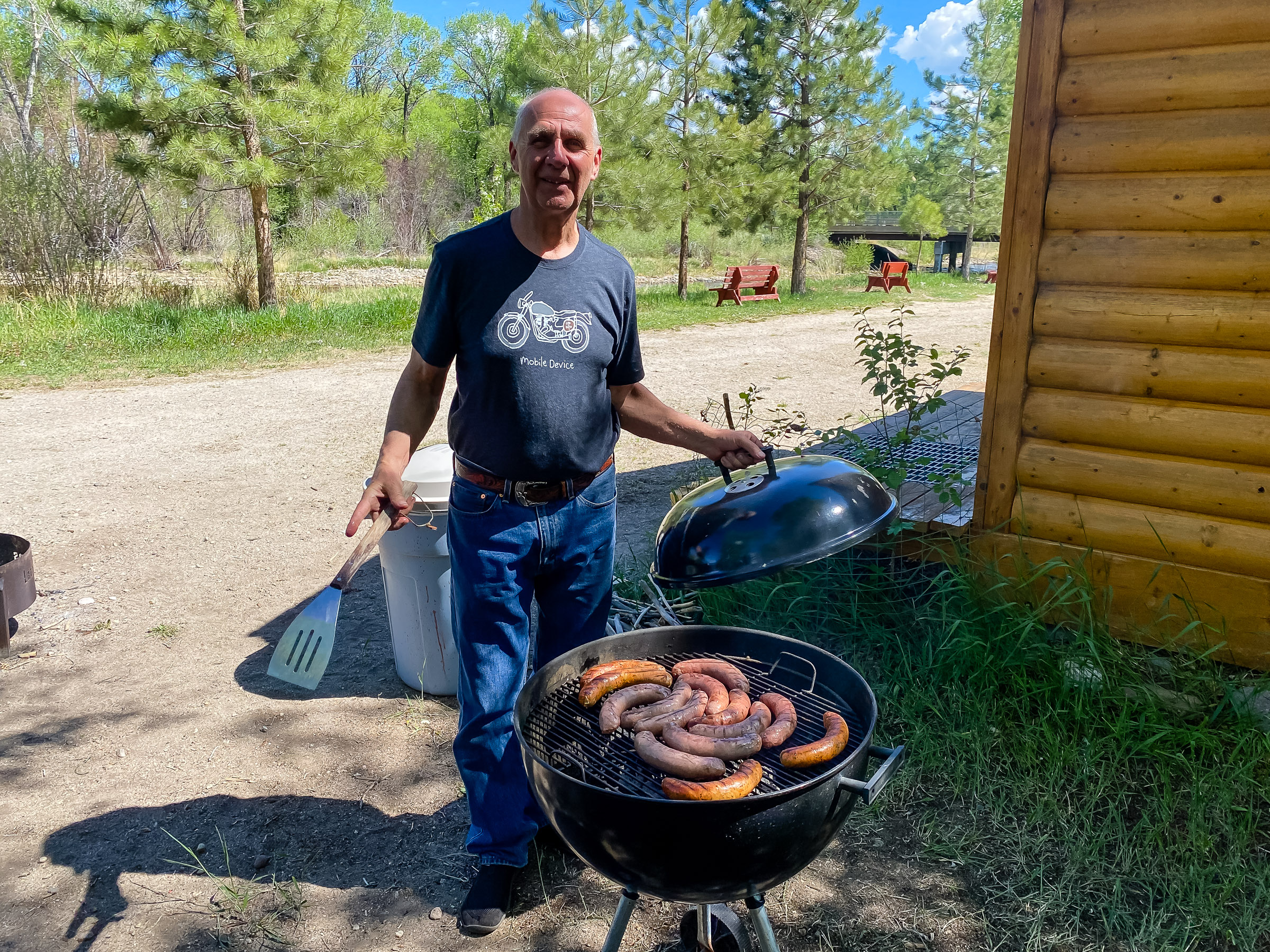 Carl Thomte grilling up some brats and italian sausage.